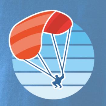 Paragliding oranžový v modrom koliesku