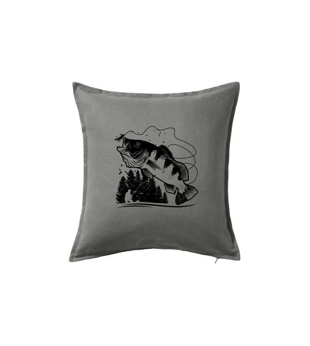 Rybár na brehu rybníka muškári