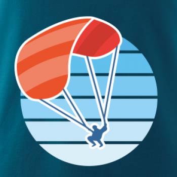 Paragliding oranžový v modrom koliesku