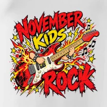 Rocková listopadová kytara s dětskými rukama