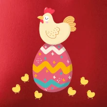 Sliepka sediaca na veľkonočnom vajci