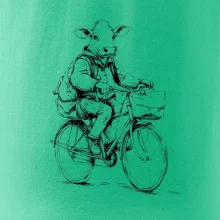 Krava v obleku na bicykli