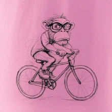 Opice s okuliarmi na bicykli