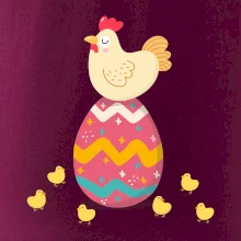 Sliepka sediaca na veľkonočnom vajci