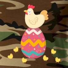 Sliepka sediaca na veľkonočnom vajci