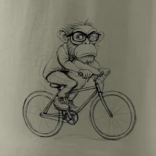 Opice s okuliarmi na bicykli