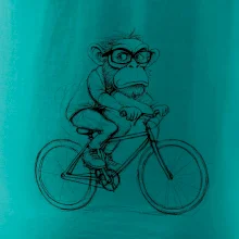 Opice s okuliarmi na bicykli