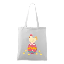 Sliepka sediaca na veľkonočnom vajci