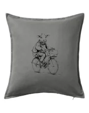 Krava v obleku na bicykli