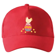 Sliepka sediaca na veľkonočnom vajci