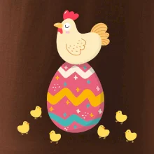 Sliepka sediaca na veľkonočnom vajci