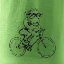 Opice s okuliarmi na bicykli