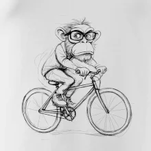 Opice s okuliarmi na bicykli