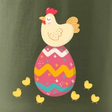 Sliepka sediaca na veľkonočnom vajci