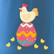 Sliepka sediaca na veľkonočnom vajci