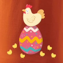 Sliepka sediaca na veľkonočnom vajci