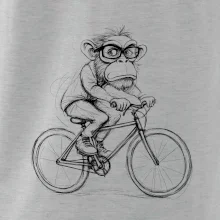 Opice s okuliarmi na bicykli