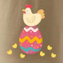 Sliepka sediaca na veľkonočnom vajci