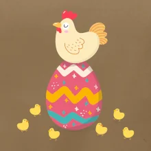 Sliepka sediaca na veľkonočnom vajci