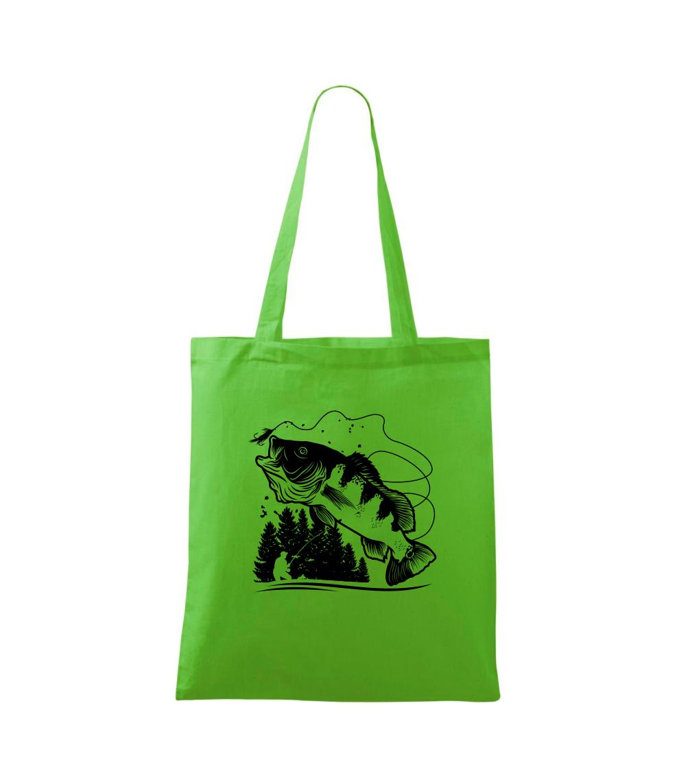 Rybár na brehu rybníka muškári