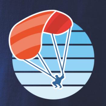 Paragliding oranžový v modrom koliesku Paragliding oranžový v modrom koliesku