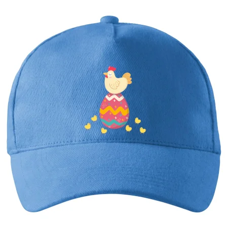 Sliepka sediaca na veľkonočnom vajci