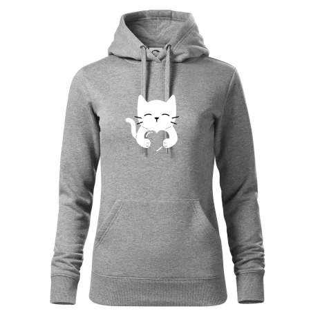Mačka drží srdce
