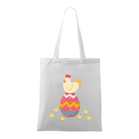 Sliepka sediaca na veľkonočnom vajci