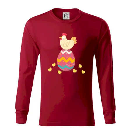 Sliepka sediaca na veľkonočnom vajci