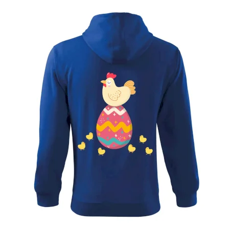 Sliepka sediaca na veľkonočnom vajci