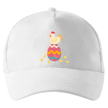 Sliepka sediaca na veľkonočnom vajci